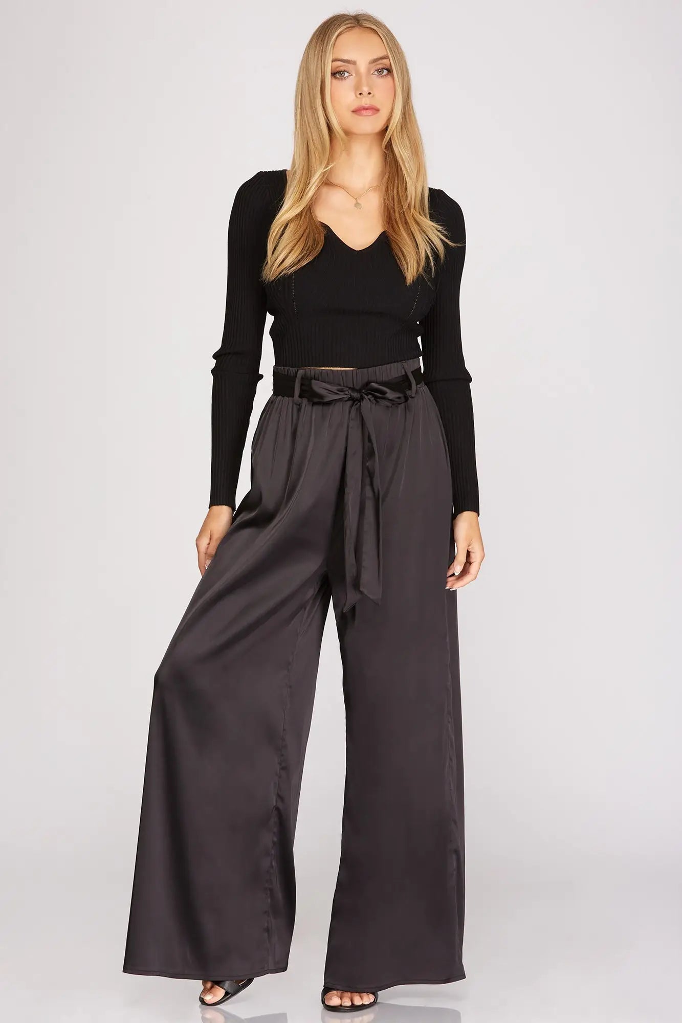 A model wearing Satin Sash Waist Wide Leg Pants in San Luis Obispo.