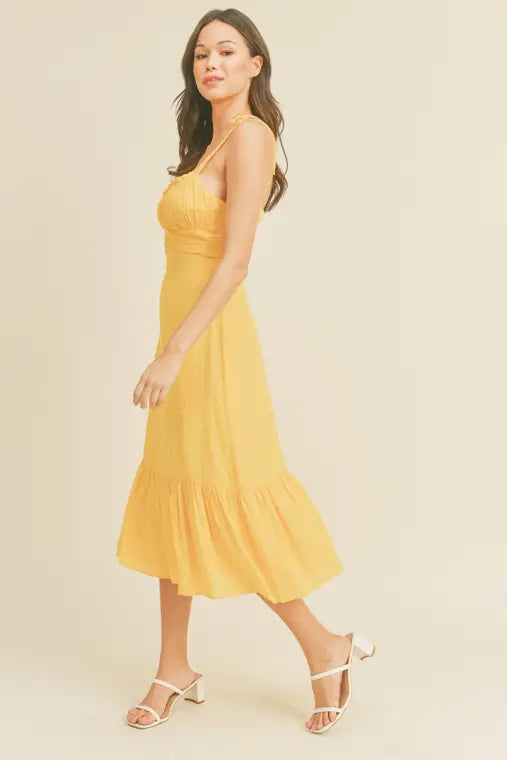 -Swiss Dot Tie Strap Midi Dress -Draped bustline detail -Ruffle detail -Back zipper closure