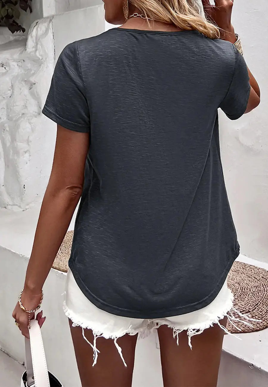 The Anna-Kaci shirt is detailed with a pretty lace detail. Features a v neck line, short sleeves, rounded hem, and flowy fit.