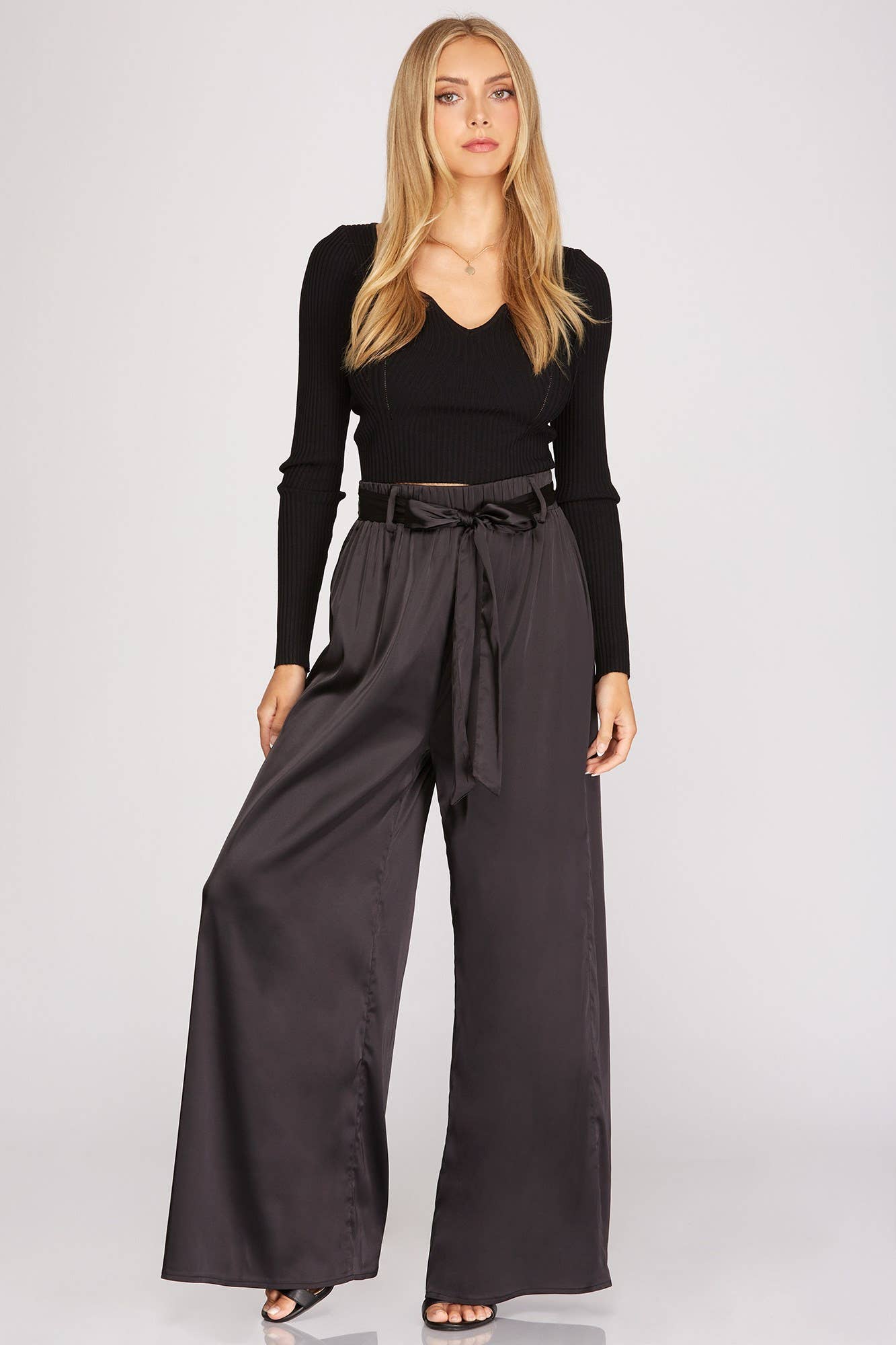A model wearing Satin Sash Waist Wide Leg Pants in San Luis Obispo.