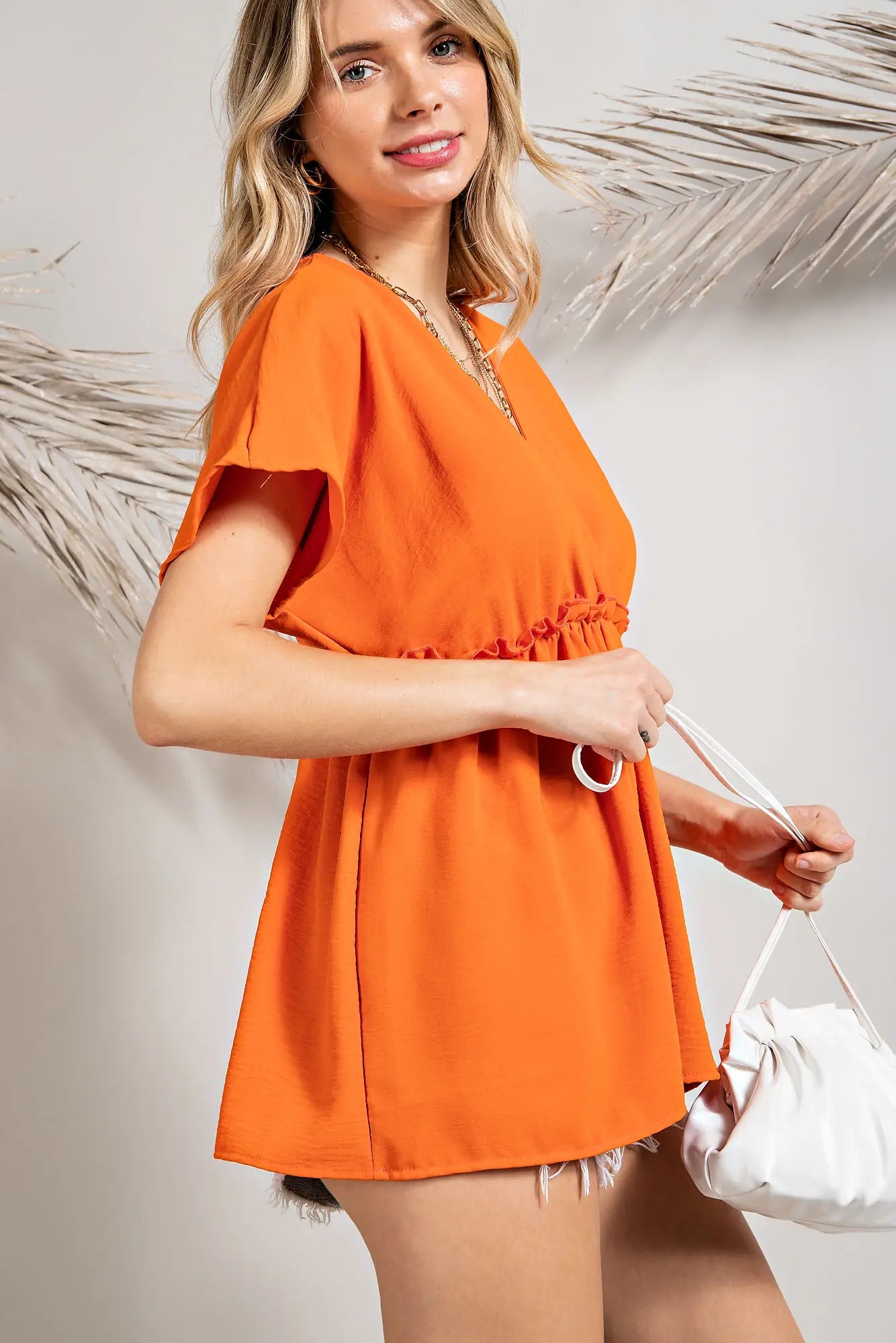This airy, woven blouse top features a surpliced front with contrasting edge ruffle detail, plus a tiered waist. This modern design will become a wardrobe staple for the San Luis Obispo woman– perfect for everything from days at the office to weekend brunch