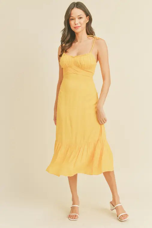 -Swiss Dot Tie Strap Midi Dress -Draped bustline detail -Ruffle detail -Back zipper closure