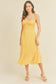 -Swiss Dot Tie Strap Midi Dress -Draped bustline detail -Ruffle detail -Back zipper closure