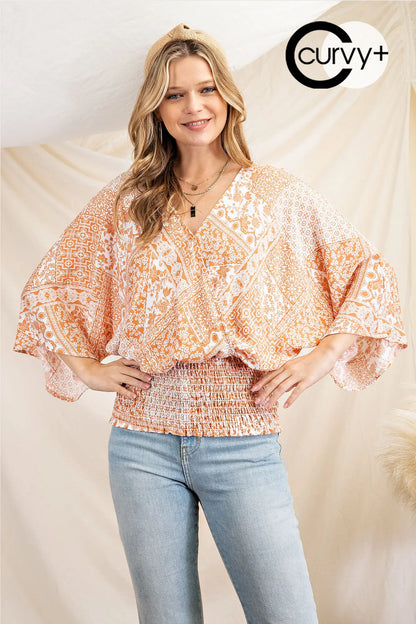 This cute plus size patchwork print blouse will have your turning heads in San Luis Obispo. It features a surpliced front with smocking waistband with 3/4 kimono sleeves. The top is woven.
