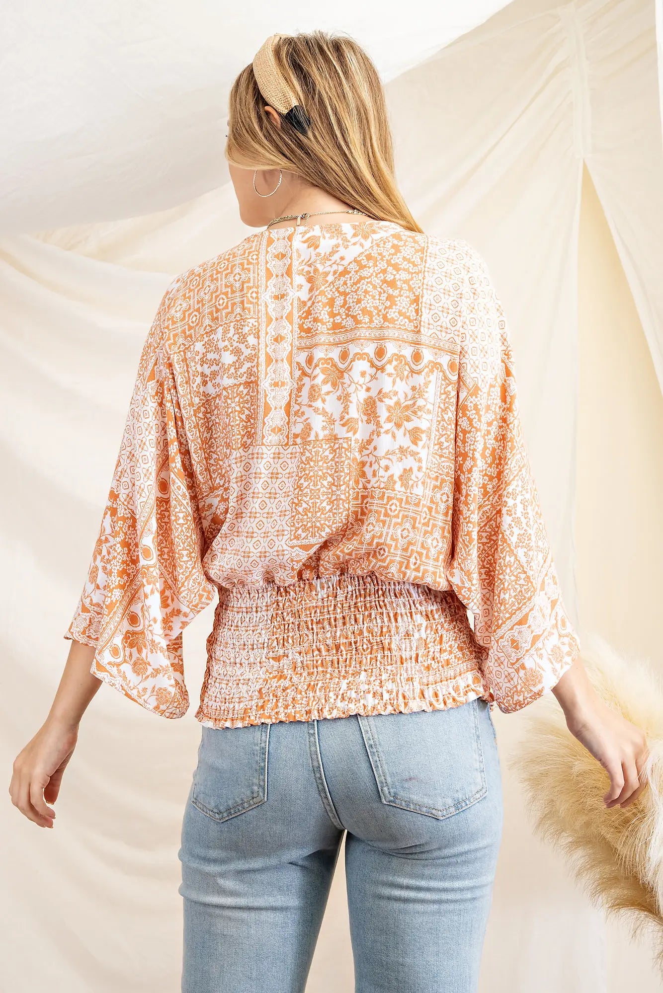 This cute plus size patchwork print blouse will have your turning heads in San Luis Obispo. It features a surpliced front with smocking waistband with 3/4 kimono sleeves. The top is woven.