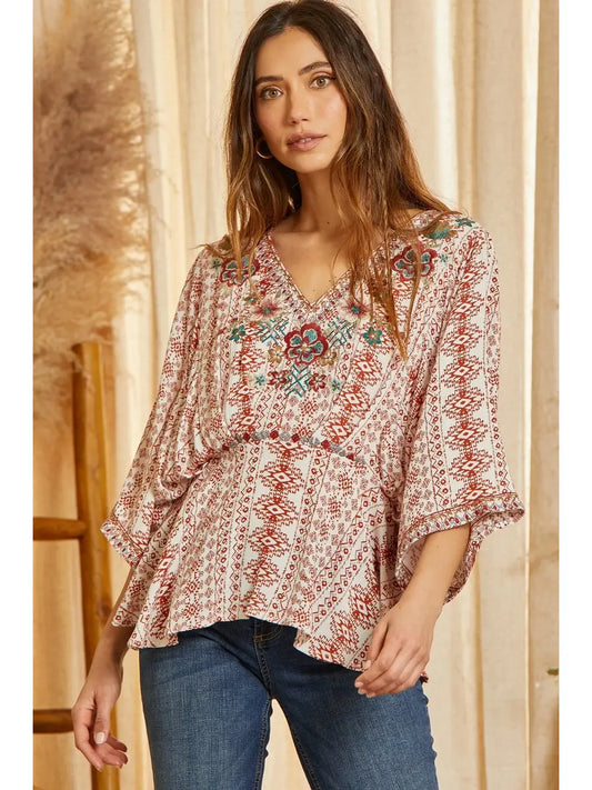  Poncho like woven top with embroidery detail on front. This top features v neckline with pleat details on the waist to give you the best shape ever!