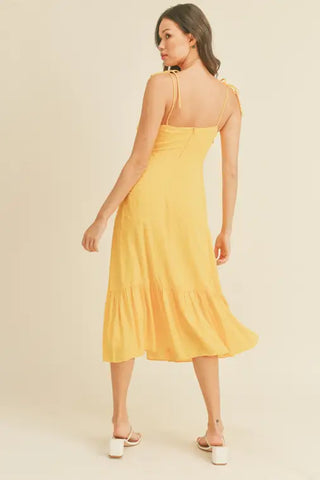 -Swiss Dot Tie Strap Midi Dress -Draped bustline detail -Ruffle detail -Back zipper closure