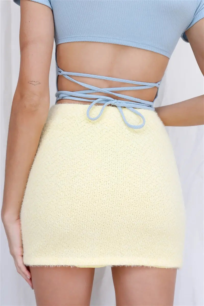 Boasting a buttery soft texture, this fuzzy solid colored mini skirt offers a high waistline, is fully lined, and features a semi-stretchy construction. Non-sheer and casual, it's also both cute and stylishly trendy, making it a must-have piece.