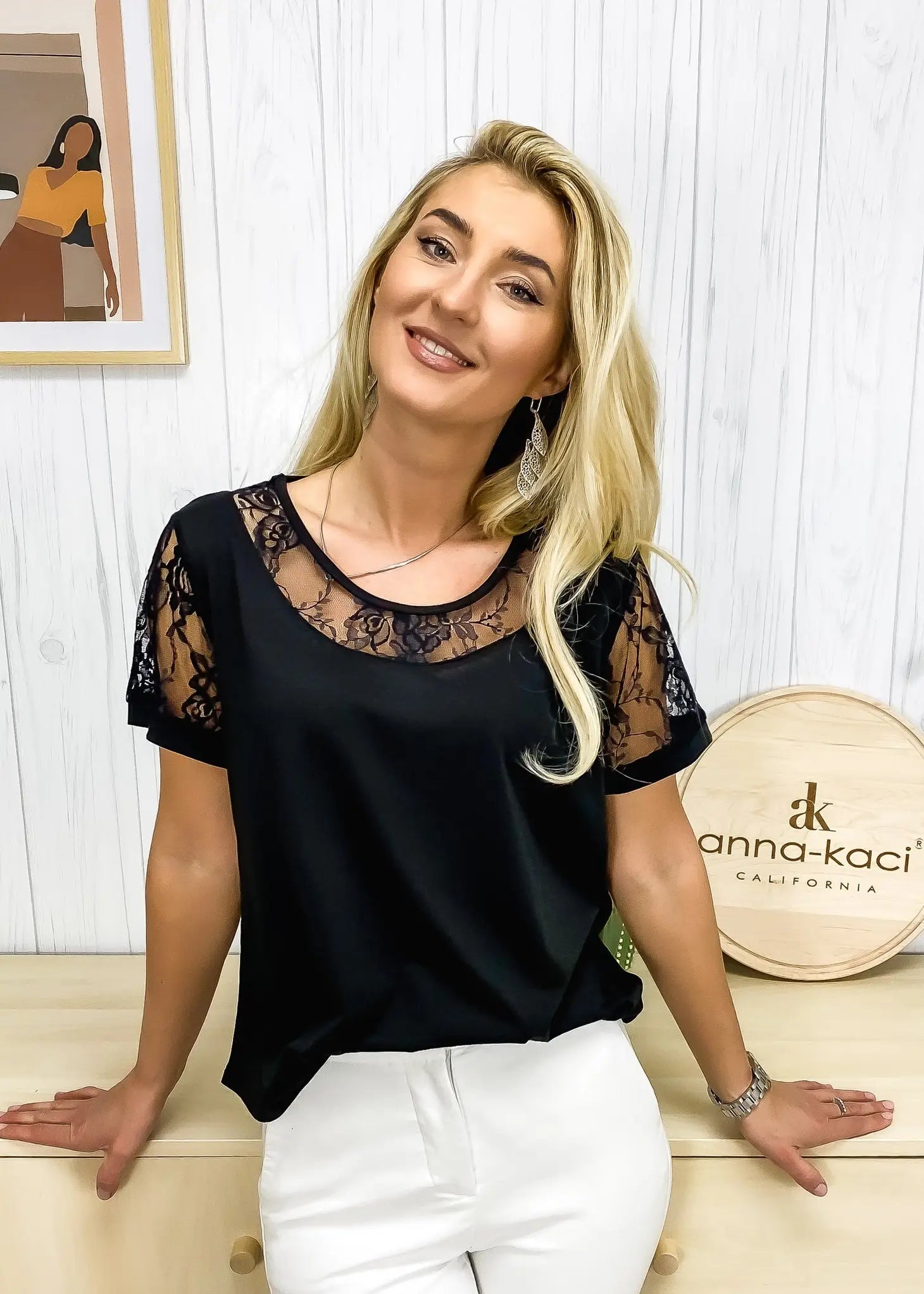 The Anna-Kaci t-shirt is detailed with elegant lace details. Features solid color, round neck line, short sleeves, and regular fit. 