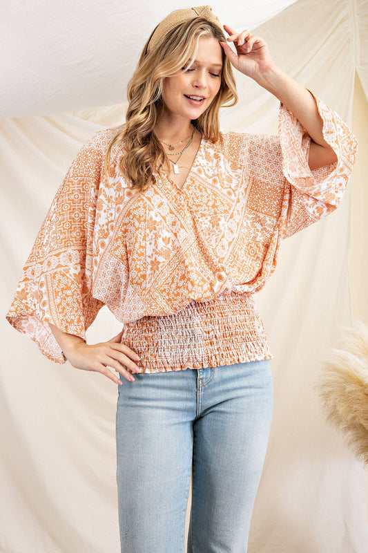 This cute plus size patchwork print blouse will have your turning heads in San Luis Obispo. It features a surpliced front with smocking waistband with 3/4 kimono sleeves. The top is  woven.