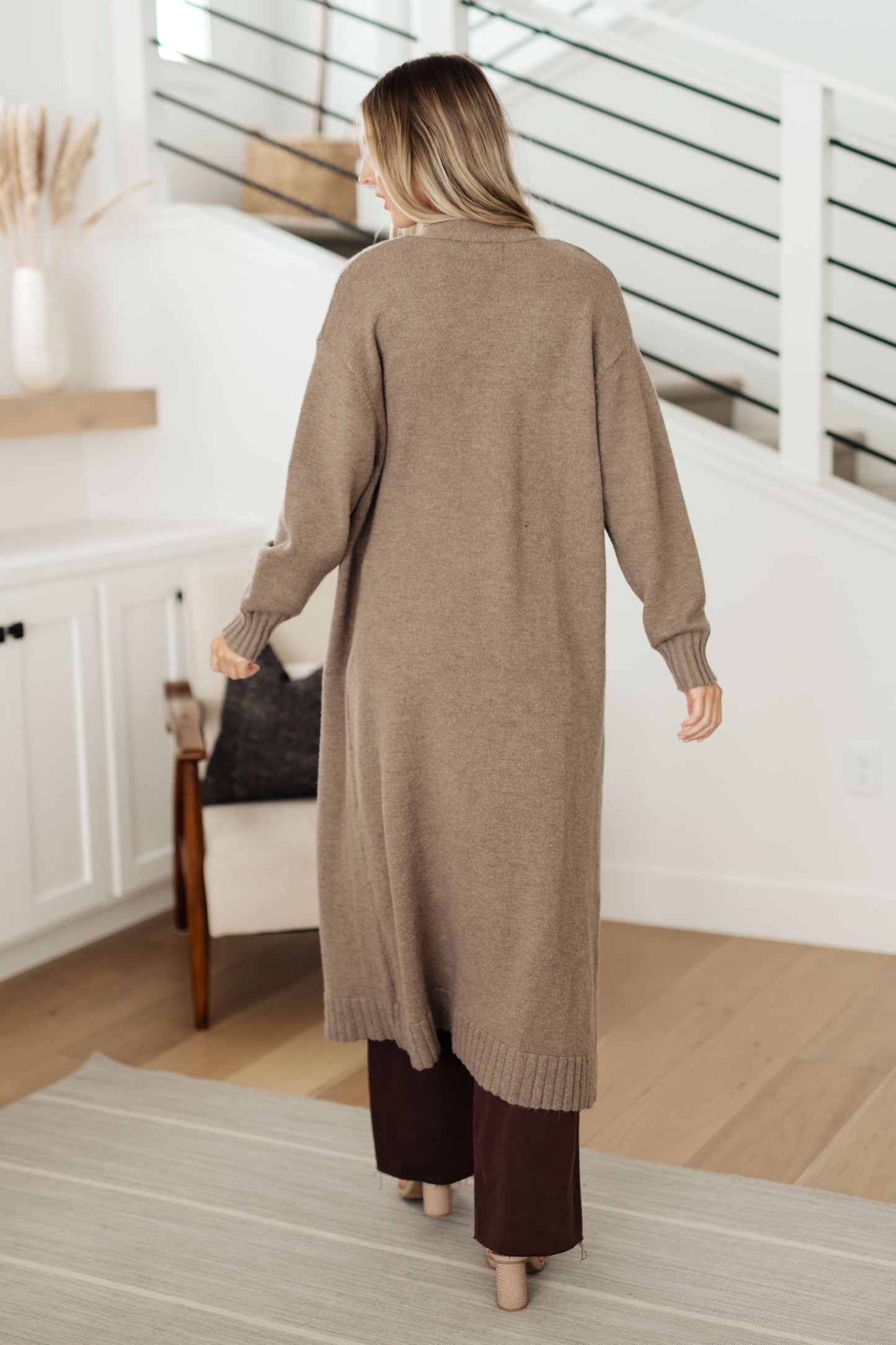 Upgrade your wardrobe this season with this Perfectly Resolved Duster Cardigan. Featuring a warm sweater knit, neutral tone, and duster length, this cardigan pairs perfectly with the perfectly resolved sweater tank for a beautiful timeless look in SLO.