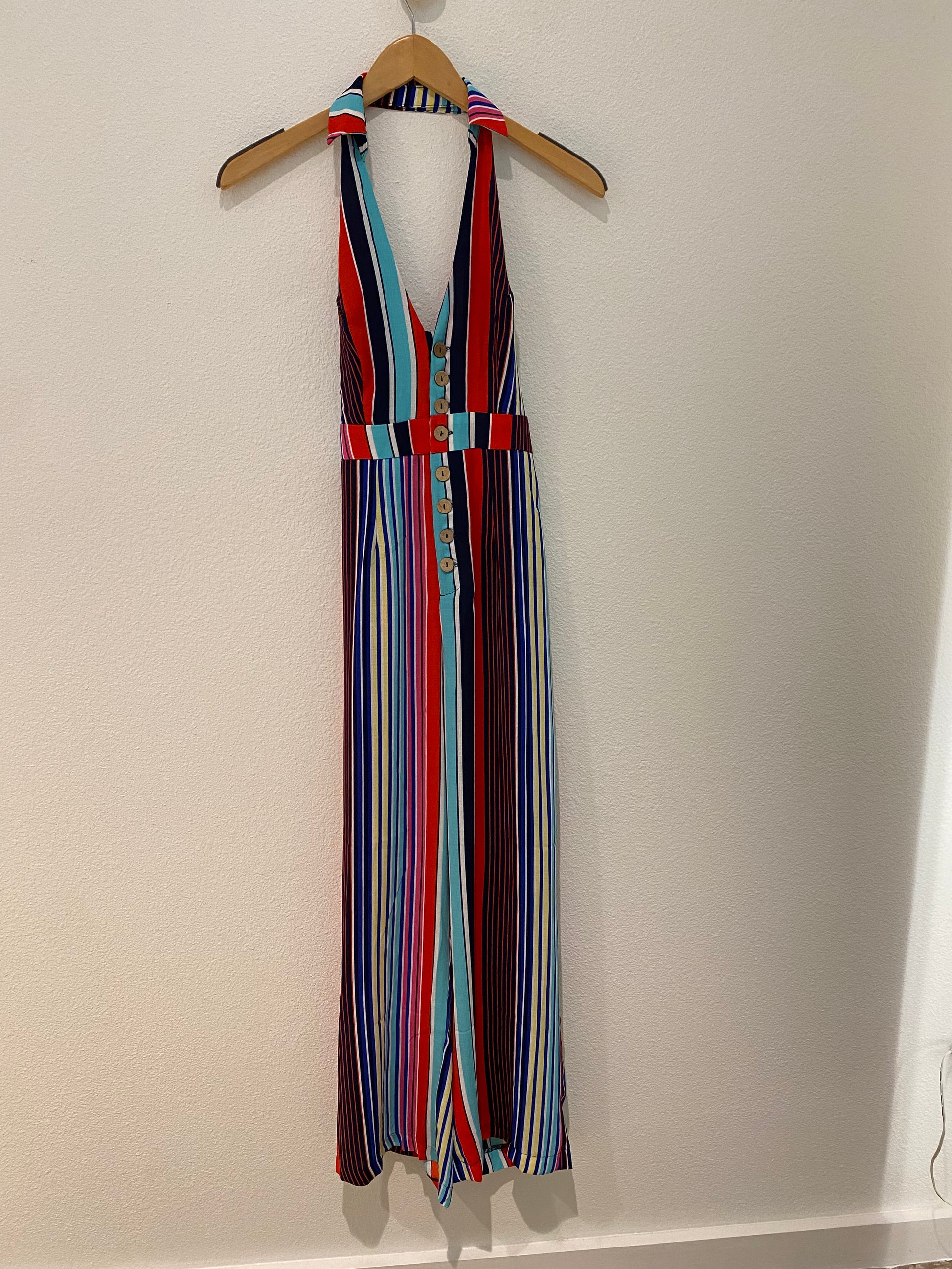 With its multicolored stripes and open back halter top